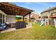 Backyard with patio, furniture, grill, playset, and green grass at 1520 Gallant Fox Ln, Suwanee, GA 30024