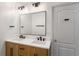 Bathroom with a double sink vanity, modern fixtures, and a well-lit mirror at 1520 Gallant Fox Ln, Suwanee, GA 30024