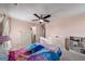 Comfortable pink bedroom featuring neutral carpet, a white bed, and a ceiling fan at 1520 Gallant Fox Ln, Suwanee, GA 30024