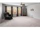 Spacious bonus room with three large windows and a cozy massage chair at 1520 Gallant Fox Ln, Suwanee, GA 30024