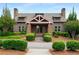 Charming clubhouse exterior with stone accents, well-manicured landscaping, and inviting entrance at 1520 Gallant Fox Ln, Suwanee, GA 30024