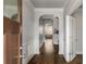 Elegant foyer with hardwood floors and a view of the living room at 1520 Gallant Fox Ln, Suwanee, GA 30024