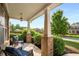 Cozy front porch with comfortable seating and lush greenery at 1520 Gallant Fox Ln, Suwanee, GA 30024