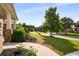 Green front yard view from covered porch showing the street and other homes at 1520 Gallant Fox Ln, Suwanee, GA 30024