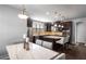 Well-appointed kitchen with stainless steel appliances, dark wood cabinets, and an island with seating at 1520 Gallant Fox Ln, Suwanee, GA 30024