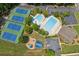 An aerial view showing all amenities, including swimming pool, tennis courts and playground at 2045 Calmwater Ct, Suwanee, GA 30024