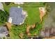 Aerial view of home with a well-manicured lawn and proximity to the lake at 2045 Calmwater Ct, Suwanee, GA 30024