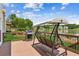 Back deck features a swing and grilling area and a beautiful water view at 2045 Calmwater Ct, Suwanee, GA 30024