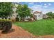 Expansive backyard with lush greenery, offering ample space for outdoor activities, with a view of neighboring homes at 2045 Calmwater Ct, Suwanee, GA 30024