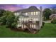 The home features a two-story deck with swing seating, perfect for relaxing evenings at 2045 Calmwater Ct, Suwanee, GA 30024