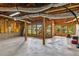 Spacious unfinished basement with exposed beams and concrete floor, offering a blank canvas for customization at 2045 Calmwater Ct, Suwanee, GA 30024