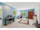 Large bonus room has piano and carpet floors perfect for activities at 2045 Calmwater Ct, Suwanee, GA 30024
