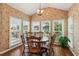 Bright dining area with vaulted ceilings and scenic backyard views at 2045 Calmwater Ct, Suwanee, GA 30024