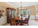 Elegant dining room featuring wainscoting, chandelier, and a bay window for natural light at 2045 Calmwater Ct, Suwanee, GA 30024
