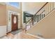 Bright foyer showcasing hardwood floors, a staircase, and elegant architectural details at 2045 Calmwater Ct, Suwanee, GA 30024