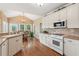 Eat-in kitchen area features vaulted ceilings and lots of sunlight at 2045 Calmwater Ct, Suwanee, GA 30024