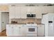 Bright kitchen offers ample counter space and updated appliances at 2045 Calmwater Ct, Suwanee, GA 30024