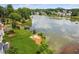 A serene lake view from the property, complemented by a lush green lawn at 2045 Calmwater Ct, Suwanee, GA 30024