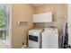 Laundry room with washer, dryer, and storage at 2045 Calmwater Ct, Suwanee, GA 30024