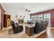 Spacious living room featuring a fireplace, hardwood floors, and plenty of natural light at 2045 Calmwater Ct, Suwanee, GA 30024