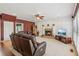 Cozy living room features a fireplace and ceiling fan at 2045 Calmwater Ct, Suwanee, GA 30024