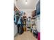 Walk-in closet provides ample storage with rods and wire shelving at 2045 Calmwater Ct, Suwanee, GA 30024