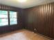 Cozy bedroom with paneled walls and carpeted floor at 2226 Medfield Ne Trl, Atlanta, GA 30345