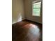 Bedroom featuring hardwood flooring and a window providing natural light at 2226 Medfield Ne Trl, Atlanta, GA 30345