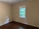 Bedroom with hardwood flooring and a window providing natural light at 2226 Medfield Ne Trl, Atlanta, GA 30345