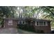 Charming brick home featuring a traditional design and mature trees in a serene setting at 2226 Medfield Ne Trl, Atlanta, GA 30345