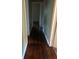Hallway featuring polished wood flooring and neutral wall paint leading to other rooms at 2226 Medfield Ne Trl, Atlanta, GA 30345
