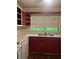 Functional kitchen features stainless steel sink, and traditional red cabinets at 2226 Medfield Ne Trl, Atlanta, GA 30345