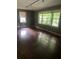 Bright living room featuring large windows and beautiful hardwood floors at 2226 Medfield Ne Trl, Atlanta, GA 30345