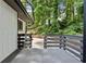 Back porch features gray floor and railing providing a view of the backyard area at 4720 Shoshonee Trl, College Park, GA 30349