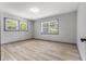 This light-filled bedroom has dual windows and light-colored wood flooring at 4720 Shoshonee Trl, College Park, GA 30349