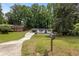 Charming home with well-manicured front yard, driveway, and lovely trees at 4720 Shoshonee Trl, College Park, GA 30349
