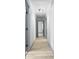 Hallway with hardwood floors, neutral walls, and doors at 4720 Shoshonee Trl, College Park, GA 30349
