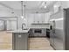 Updated kitchen featuring stainless steel appliances, bright cabinets, and quartz countertops at 4720 Shoshonee Trl, College Park, GA 30349