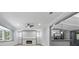Open-concept living room with an electric fireplace and view into kitchen at 4720 Shoshonee Trl, College Park, GA 30349