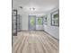 View of a large living room with multiple windows and a back door at 4720 Shoshonee Trl, College Park, GA 30349