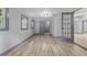 Spacious living room featuring wood floors and doors leading to other rooms at 4720 Shoshonee Trl, College Park, GA 30349