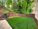 Spacious backyard featuring a manicured lawn, a privacy fence, and tasteful landscaping at 9195 Tuckerbrook Ln, Alpharetta, GA 30022