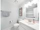 Cozy bathroom features a bright, clean aesthetic with a framed mirror and decorative accent sign at 9195 Tuckerbrook Ln, Alpharetta, GA 30022