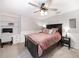 Cozy bedroom with dark wood furniture, carpet, and wainscoting paneling, featuring a built-in desk at 9195 Tuckerbrook Ln, Alpharetta, GA 30022