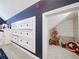 Bedroom with unique custom storage and charming play area with shiplap walls, creating a cozy retreat at 9195 Tuckerbrook Ln, Alpharetta, GA 30022
