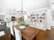 Bright kitchen with granite countertops, pendant lighting, and modern stainless steel appliances at 9195 Tuckerbrook Ln, Alpharetta, GA 30022