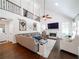 Bright living room boasts a soaring ceiling, a fireplace, and second story railing at 9195 Tuckerbrook Ln, Alpharetta, GA 30022