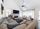 Bright living room with cozy seating, fireplace, and large windows offers a relaxing space at 9195 Tuckerbrook Ln, Alpharetta, GA 30022