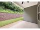 The backyard has lush landscaping, a retaining wall, and is the perfect space to relax in at 131 Prominence Ct, Canton, GA 30114