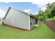 The home's exterior features a retaining wall and lush lawn at 131 Prominence Ct, Canton, GA 30114
